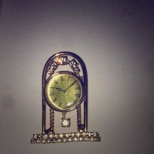 Diamond and gold clock pin