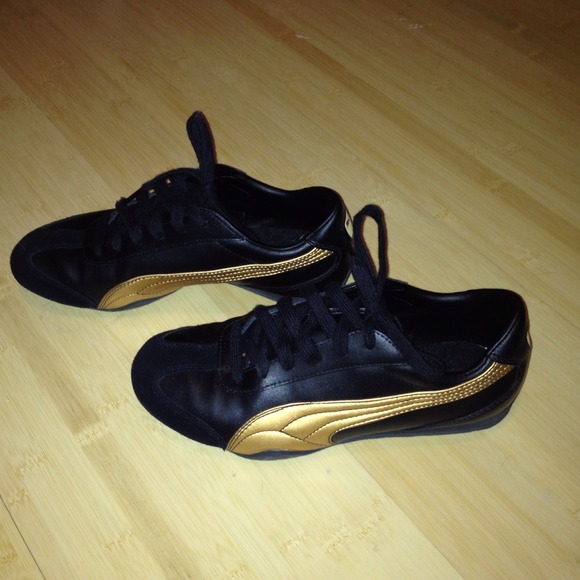 Puma Black and Gold Sneakers