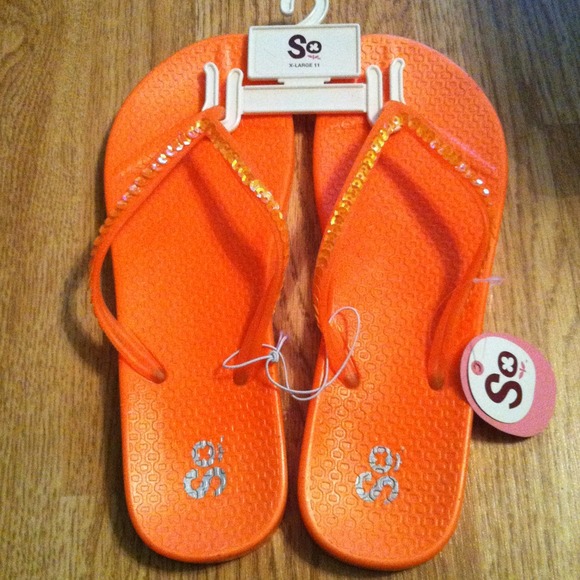 Orange and green flip flops