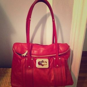 Bright red handbag with gold accents