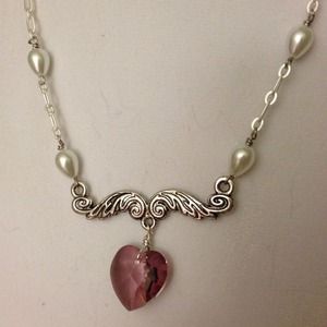 Swarovski crystal 18mm heart necklace 16" long.
