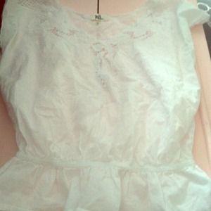 Adorable white peplum top!