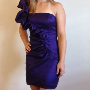Purple one shouldered party dress.