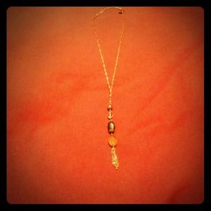 Gold and tortoise drop necklace