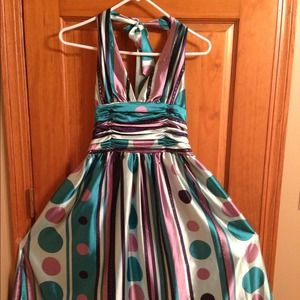 Silk halter dress with multi-colored design.