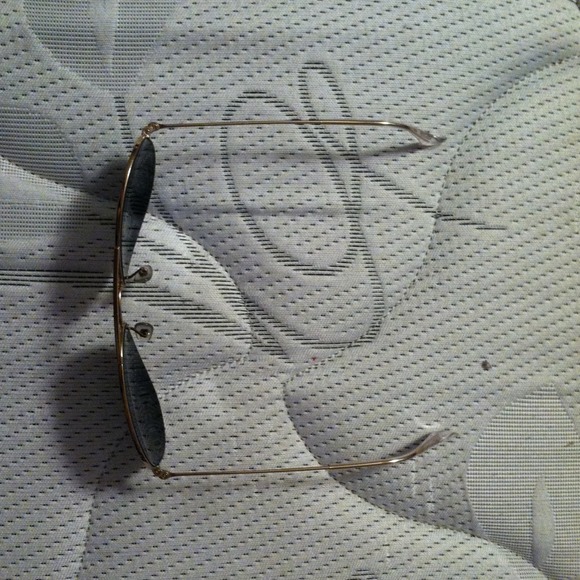 A pair of black and gold aviators