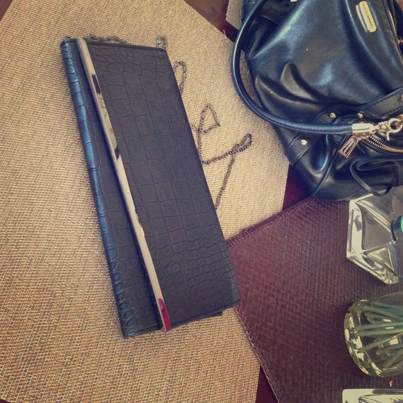 Black clutch with detachable gunmetal strap