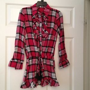 Plaid buttoned up shirt with ruffles.
