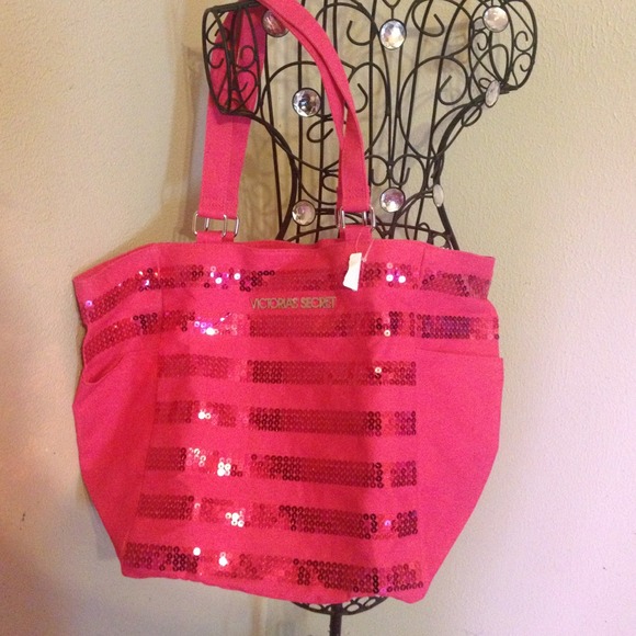 Hot pink Vitoria Secret tote bag.