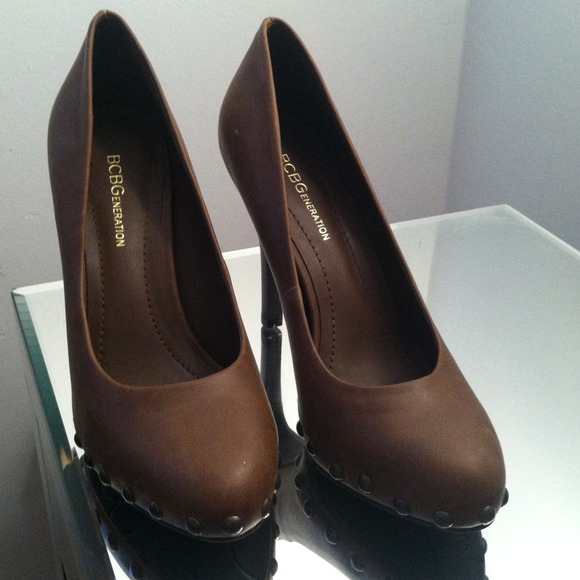 Chocolate pair of BCBG pumps with studded bottoms