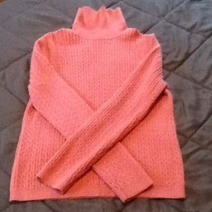 Bundle of Orange and brown sweaters.