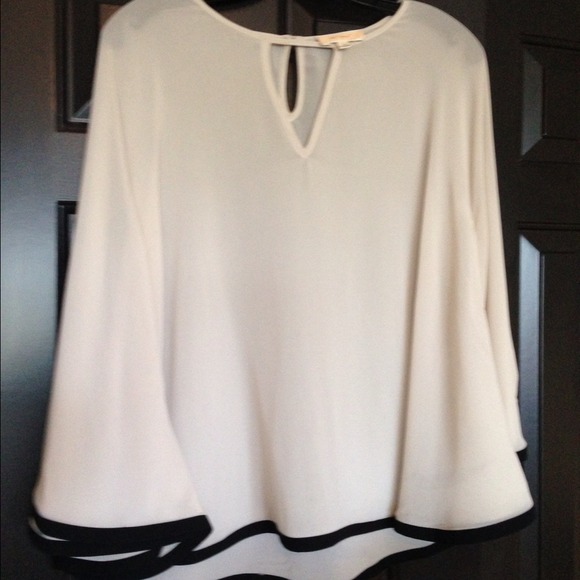 New and never worn. White blouse.