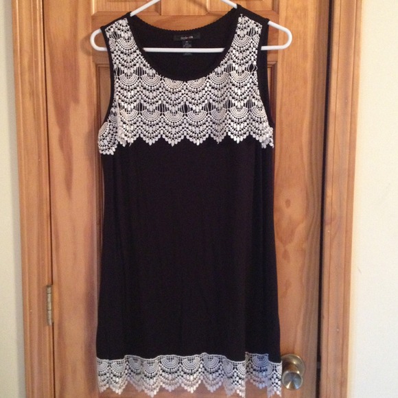Black dress with lace around the bottom and top