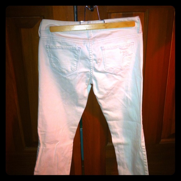 American Eagle white destroyed skinny jeans.