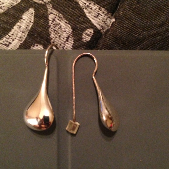 SOLD.   Long silver earrings