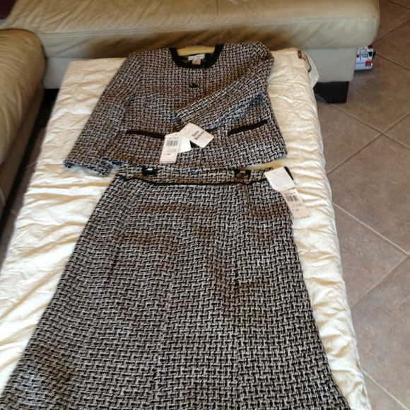 100% silk lining, top size 10. Skirt size 12.