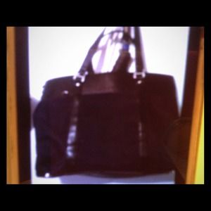 Black purse with handles.