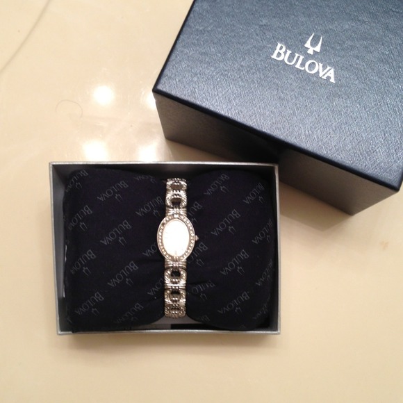 Bulova watch with Swaroaki crystal with receipt.