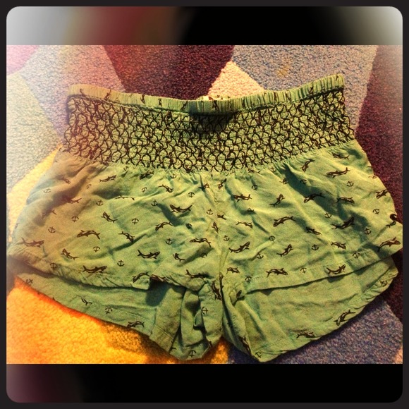 Teal colored shorts with whales and anchors.