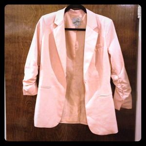 Soft pink blazer.