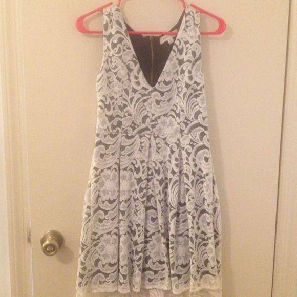 Very cute white laced dress with black underneath
