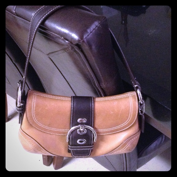 its a small nice brown coach !!! good condition !!