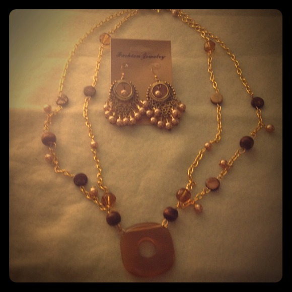 Brown necklace and earrings sold