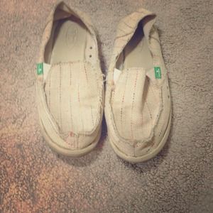 Tan Sanuks with rainbow stitching