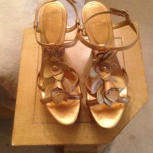 100% authentic pair of gold coach wedge/heels