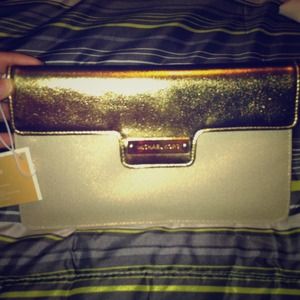 Auth MK gold clutch NWT