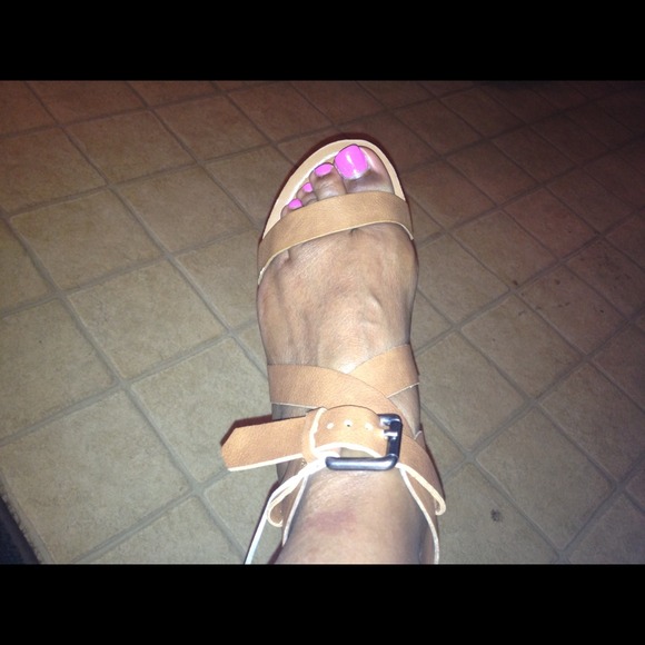 Brown sandal with copper plated heel.