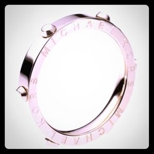 Silver colored MK ring sized 6