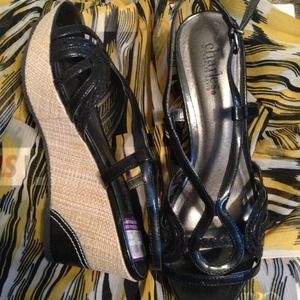 Black sandals with tan wicker cross stitch  wedge