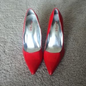 Pointed red heels