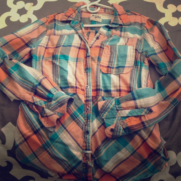 Plaid button down shirt.