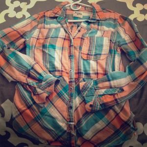 Plaid button down shirt.
