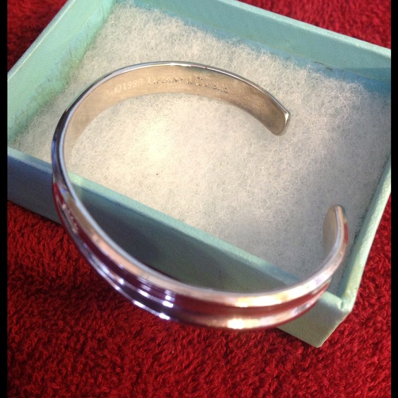 Hold Tiffany & Co. Bangle bracelet