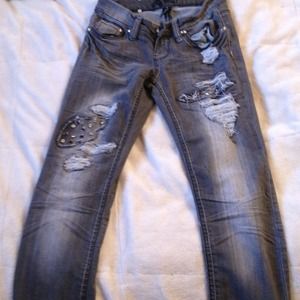 Faded gray skinny jeans with studs