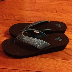 Brand new wedge sparkly blue flip flops!
