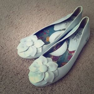 White b.o.c slip-ones with white flower detail.