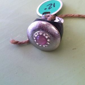 Black ring with pink stone