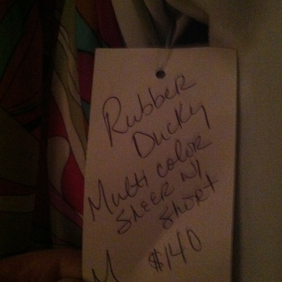 Jumpsuit with slits all around but has lining - Picture 2 of 2