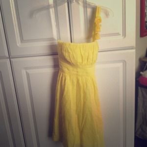 Yellow spring dress with flower detail.
