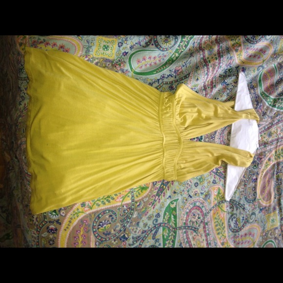 Mustard yellow tank top that crosses at back