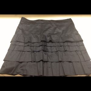 Fun and flirty black mini skirt with ruffles.