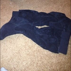 Black suede boots .