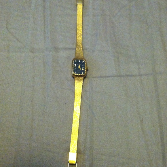 Elgin gold tone watch w diamond