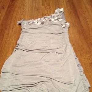 Long one shoulder form fitting top.