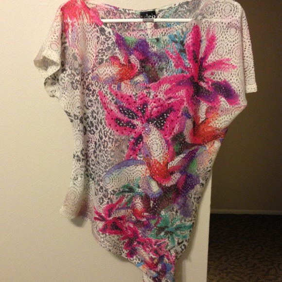 Loose, asymmetrical lace top.