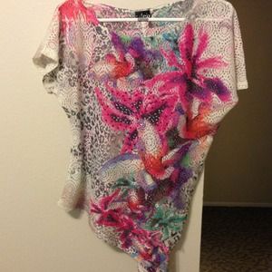 Loose, asymmetrical lace top.